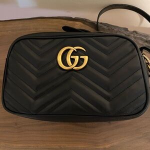 Authentic 
Gucci Black Quilted Leather GG Camera Crossbody with Gold Hardware